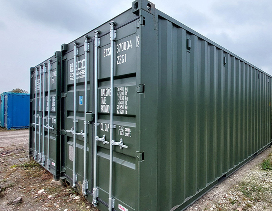 two green shipping containers, used, ready for purchase