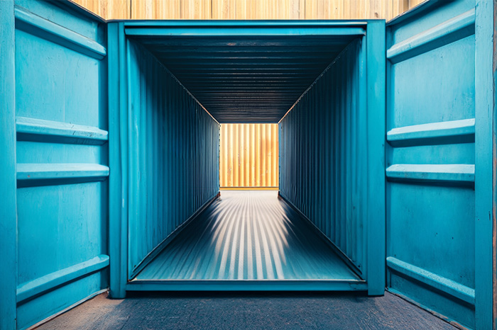 Shipping container open on both small ends so you can see through, color blue