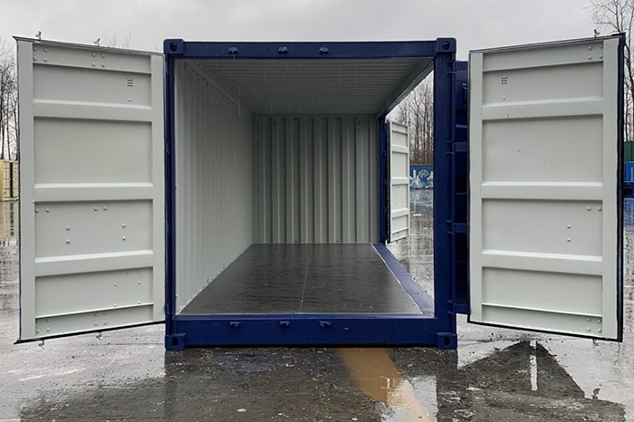 An open shipping container with the open end and open long side