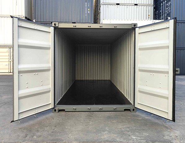 stacked shipping containers, and the bottom one is open
